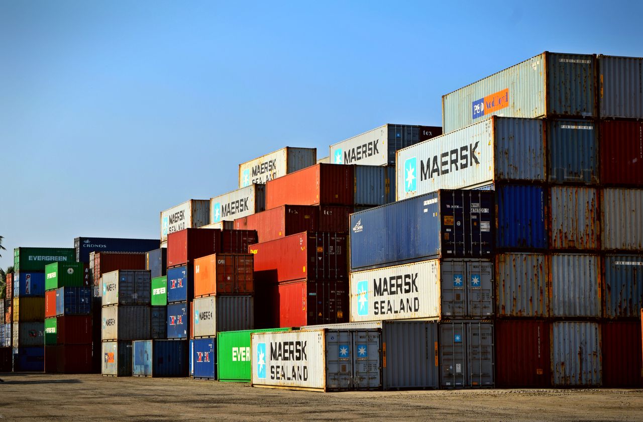Crafting Captivating Headlines: Your awesome post title goes here Colorful stacked shipping containers at a port exemplify global logistics.